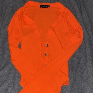 Orange long sleeve body suit